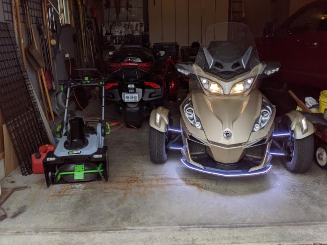 Snow blower and Spyder in the garage