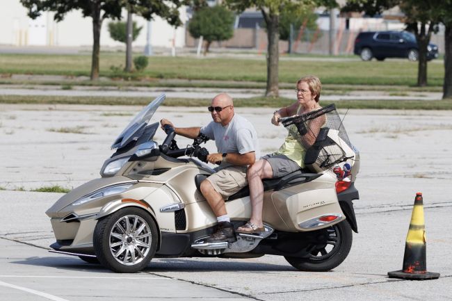 A couple on a Cam-Am Spyder navigating through cones. Copyright: Sherwood Archibald, 2025.  Used with permission.