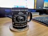Coffee Cup on desk. South Dakota is written on the coffee cup.