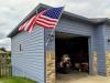 United States Flag with Can-Am Spyder in the garage.