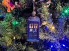 A Doctor Who Christmas Ornament hanging from a Christmas Tree