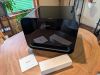 The WiiM Sub Pro sitting on a table for display